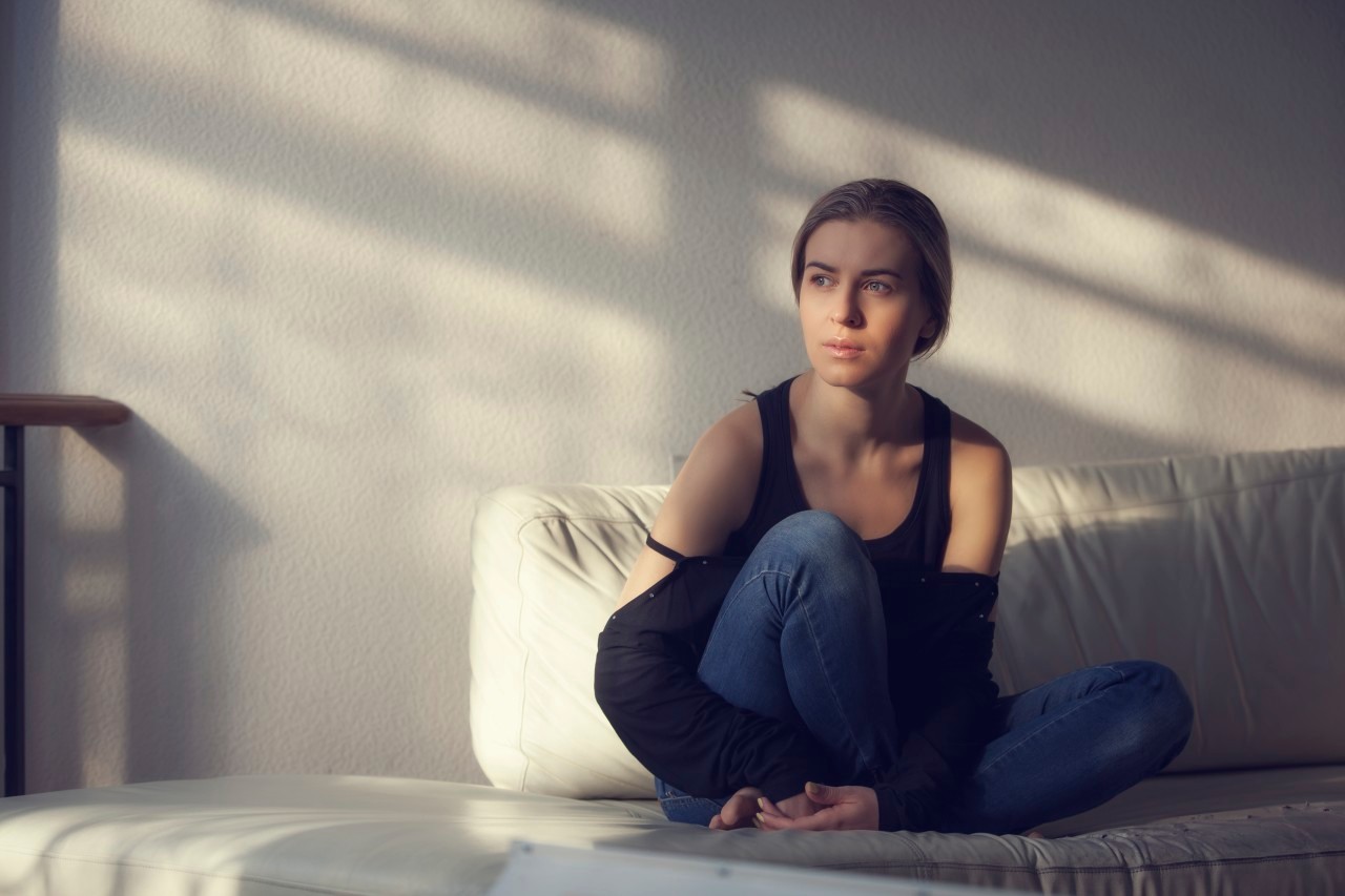 06 Dec 2014 --- Pensive alone woman at home --- Image by © 3photo/Corbis