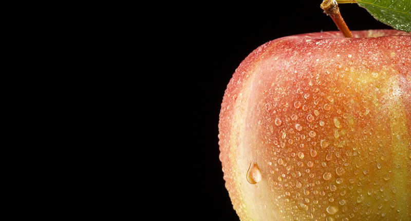 Close-up of apple, studio shot --- Image by © Marc Wuchner/Corbis