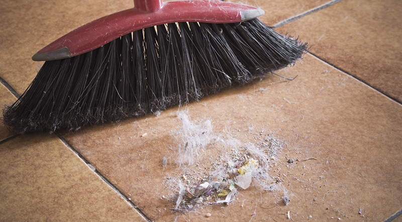 Broom and dirt --- Image by © Ken Welsh/Design Pics/Corbis