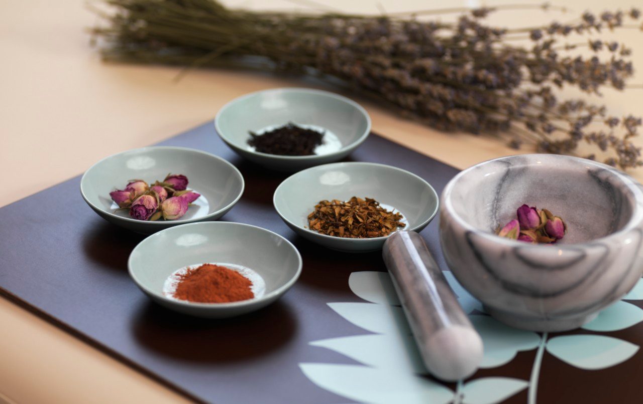 Mortar and Pestle with Dried Herbs --- Image by © Radius Images/Corbis