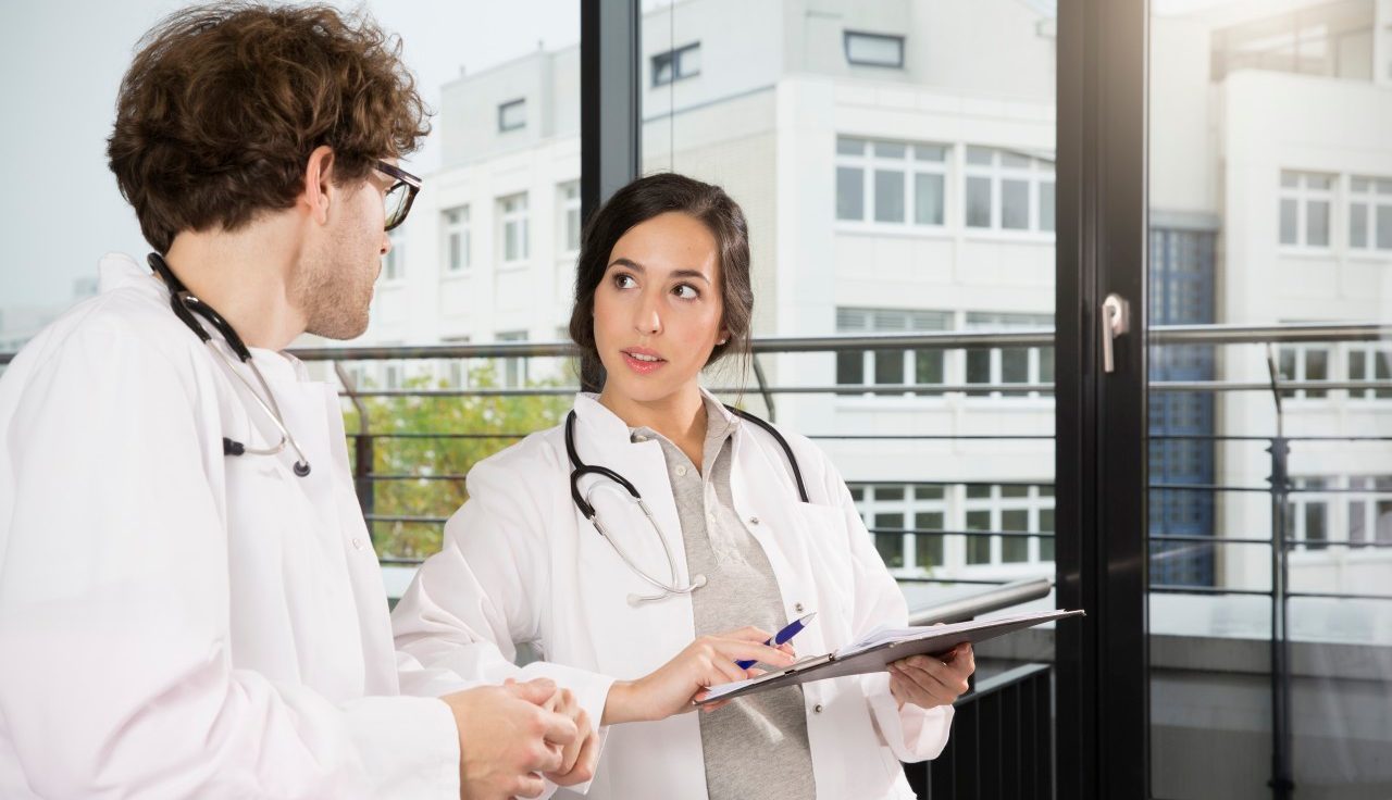 31 Oct 2014 --- Doctors checking documents --- Image by © Florian Kuttler/Westend61/Corbis