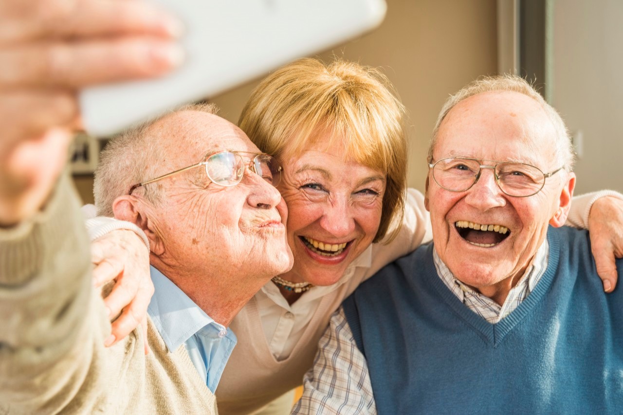 13 Feb 2015 --- Cheerful seniors taking selfie --- Image by © Uwe Umstätter/Westend61/Corbis