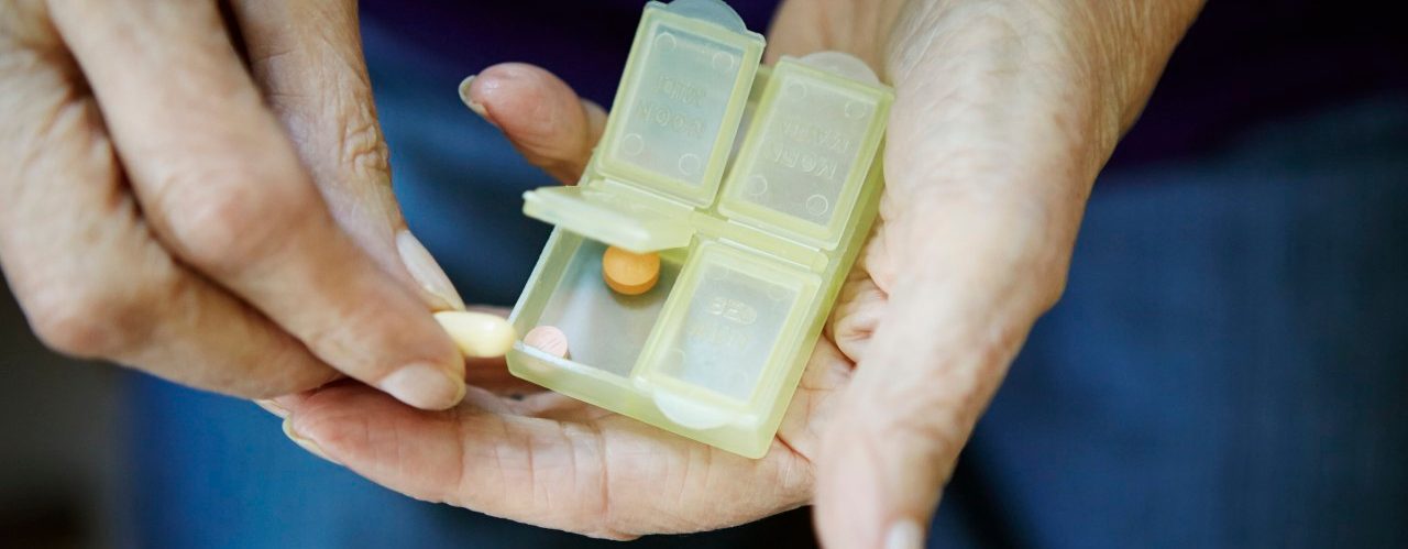 17 Feb 2014 --- Close up of 82 year old senior woman's hand with pill box --- Image by © Kathleen Finlay/Corbis