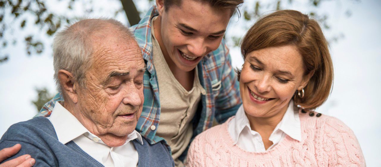 31 Oct 2014 --- Senior man with grandson and daughter looking at photo album --- Image by Â© Uwe UmstÃ¤tter/Westend61/Corbis