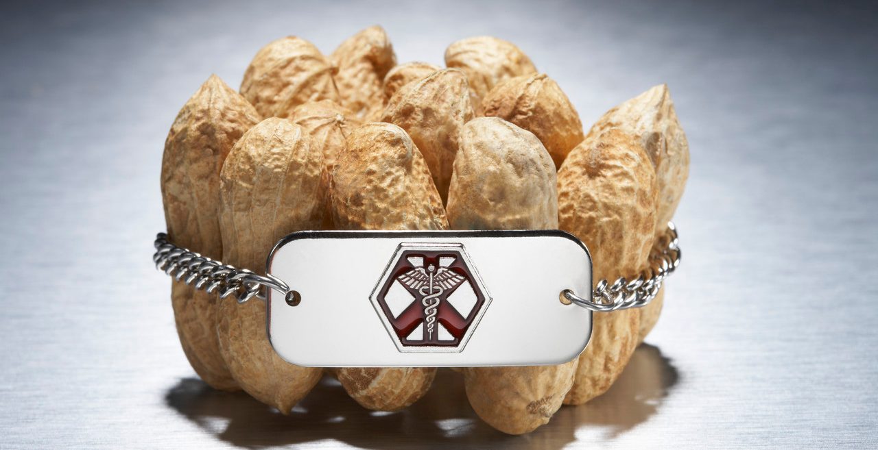 Medical alert bracelet around peanuts --- Image by © Peter Reali/Corbis