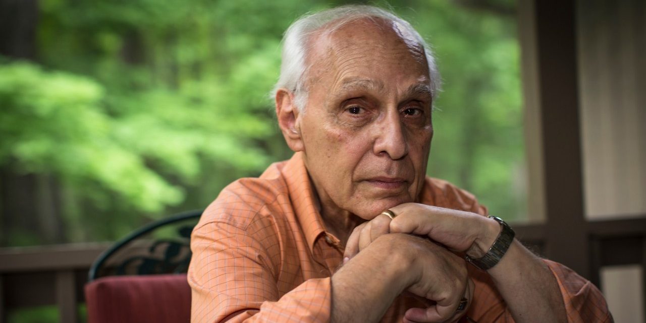 Senior man with hands on chin, portrait --- Image by © Steve Prezant/Corbis