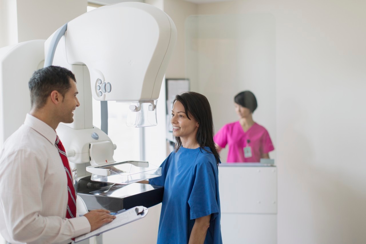 17 Jul 2012 --- Doctor talking with patient about mammograph procedure. --- Image by © Hero Images/Corbis