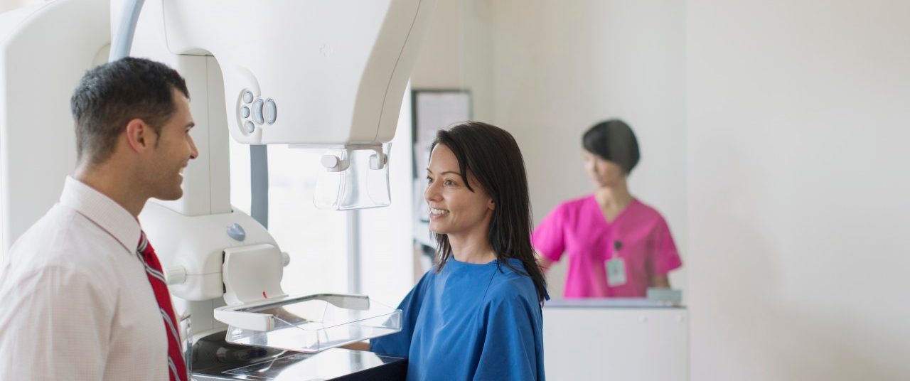 17 Jul 2012 --- Doctor talking with patient about mammograph procedure. --- Image by © Hero Images/Corbis