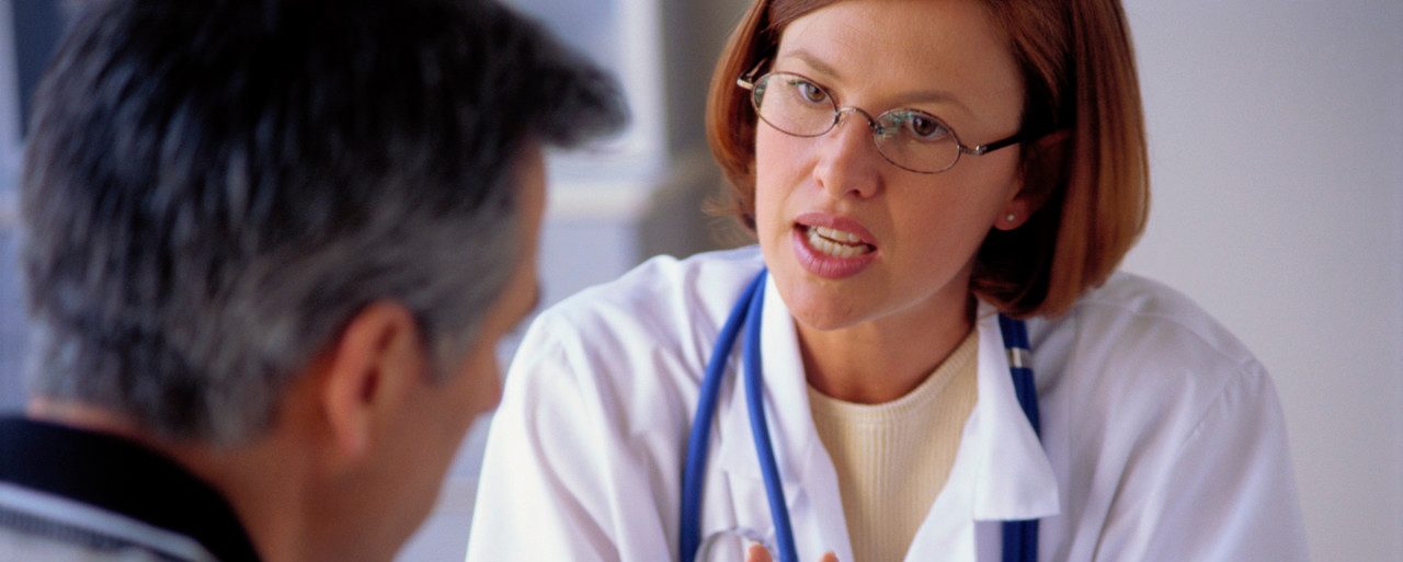 Physician Consulting Patient --- Image by © Stephen Welstead/LWA/Corbis