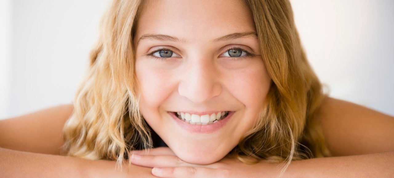 18 Jun 2014 --- Portrait of smiling girl (12-13) --- Image by © Jamie Grill/Tetra Images/Corbis