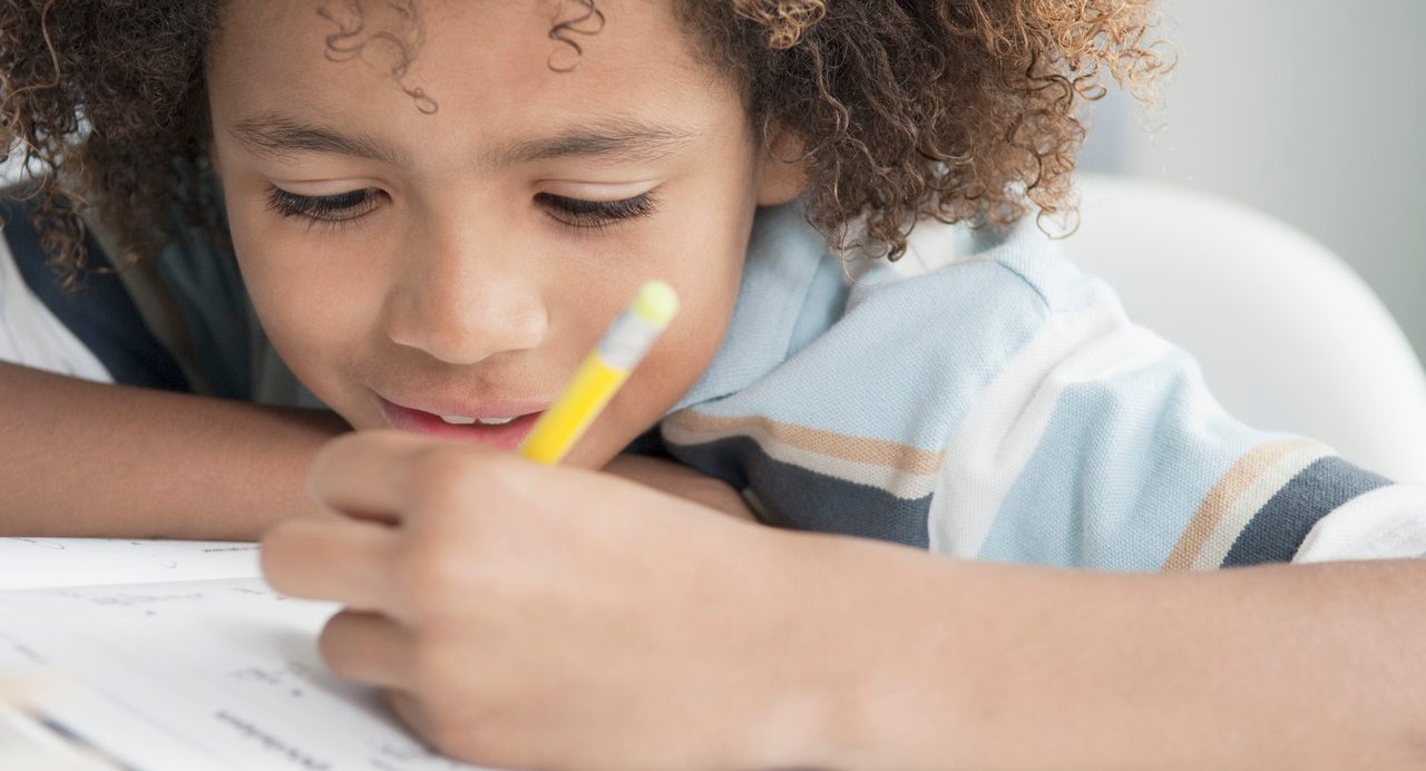 Little boy writing --- Image by © Beau Lark/Corbis