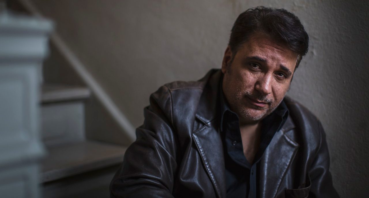 08 Nov 2014 --- Portrait of mature man sitting alone on stairway --- Image by © Steve Prezant/Corbis