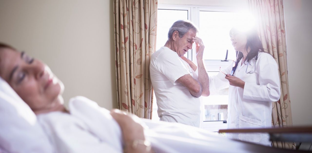 11 Sep 2014 --- Doctor consoling senior man in hospital --- Image by © zerocreatives/Westend61/Corbis