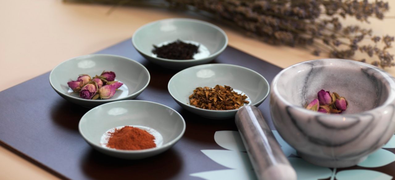 Mortar and Pestle with Dried Herbs --- Image by © Radius Images/Corbis