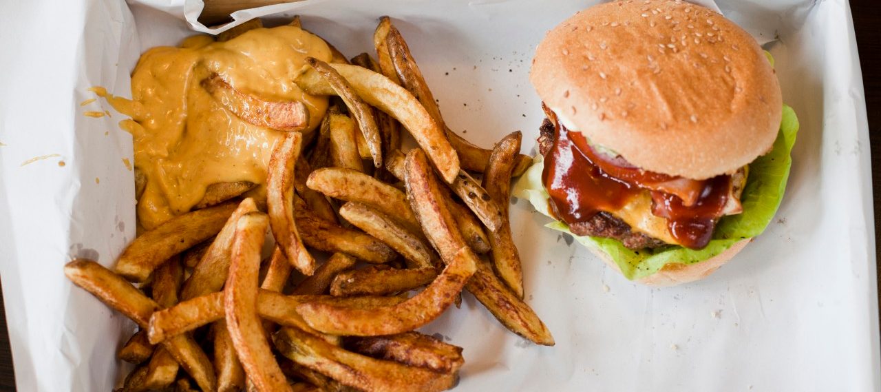 14 May 2014 --- Box with hamburger and French Fries with sauce --- Image by © Felix Eisenmeier/Westend61/Corbis