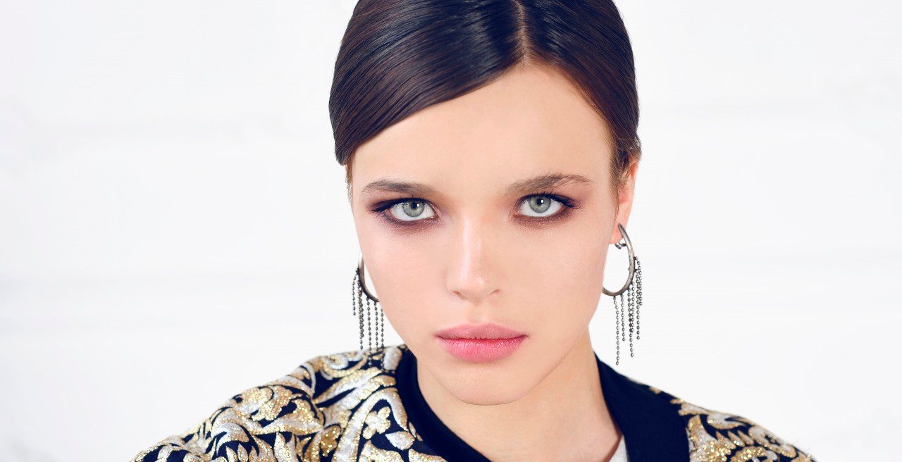 Italy --- Close-up Portrait of Young Woman --- Image by © Radius Images/Corbis