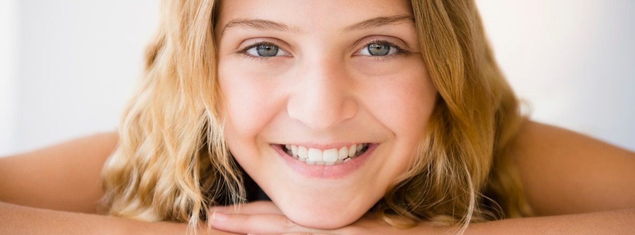 18 Jun 2014 --- Portrait of smiling girl (12-13) --- Image by © Jamie Grill/Tetra Images/Corbis