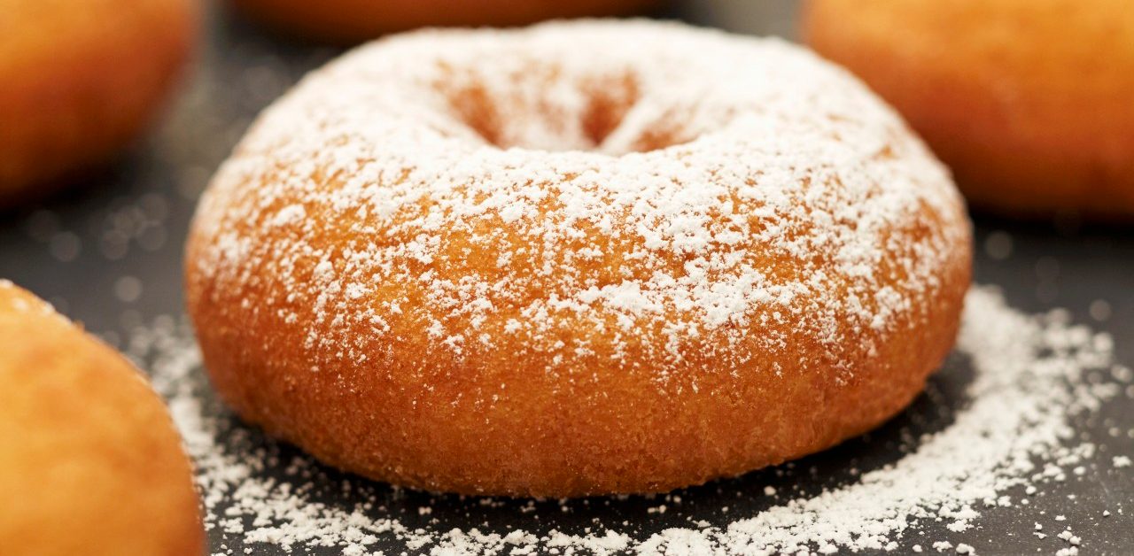 Old Fashioned Donuts; One with Powdered Sugar --- Image by © the food passionates/Corbis