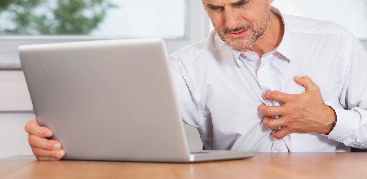 31 Aug 2014 --- Man office stress heart attack burnout anxiety --- Image by © Chris Walsh/Corbis