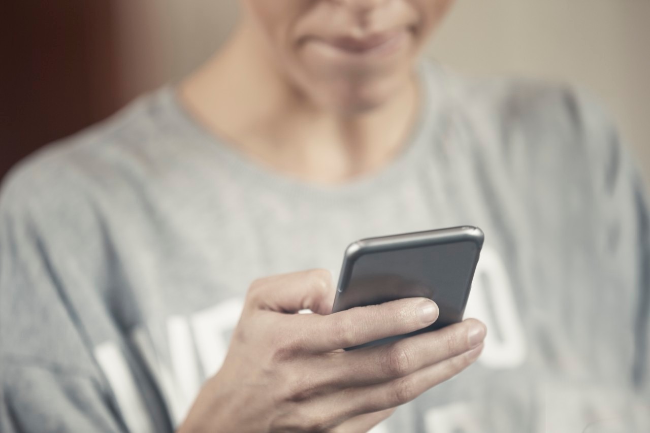 24 Apr 2015 --- Woman using smartphone --- Image by © Arman Zhenikeyev/Corbis