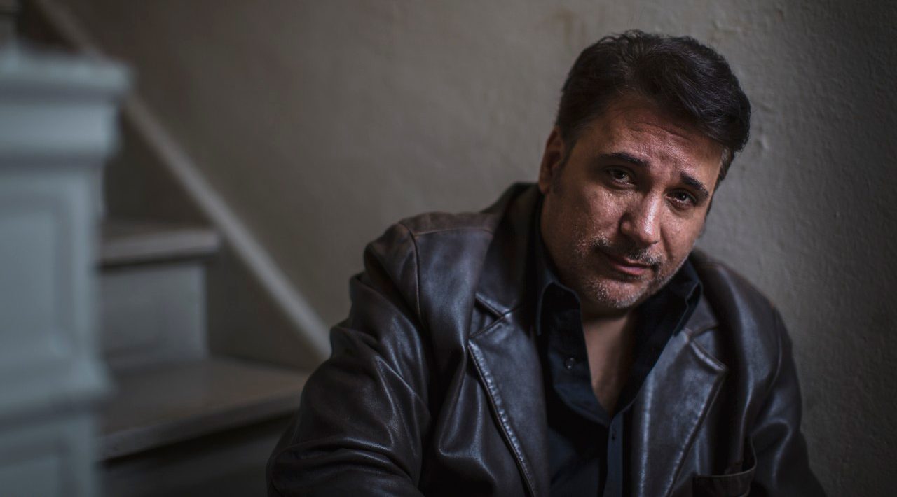 08 Nov 2014 --- Portrait of mature man sitting alone on stairway --- Image by © Steve Prezant/Corbis