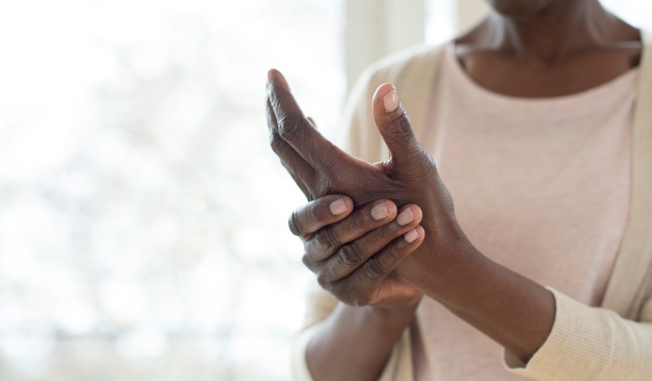 Mature woman with painful hand.