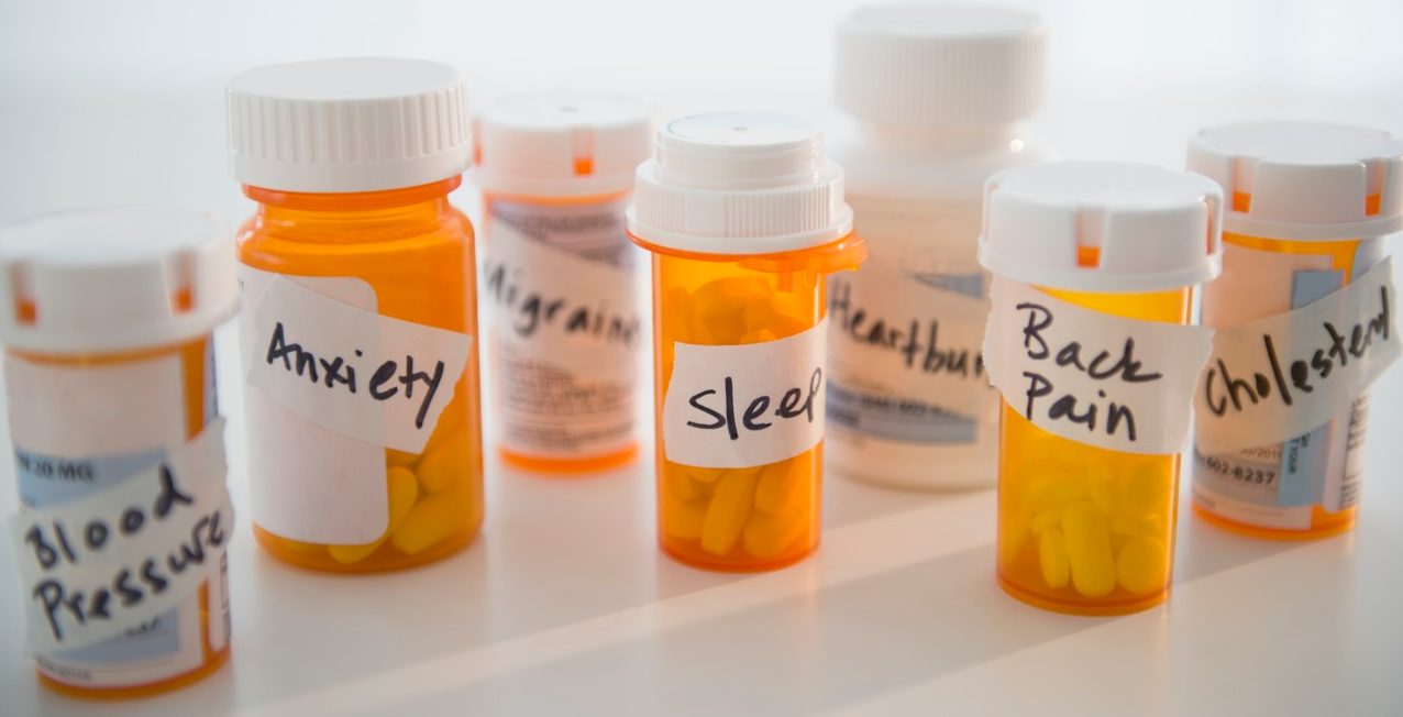 14 Mar 2014 --- Studio shot of pill bottles --- Image by © Jamie Grill/Tetra Images/Corbis