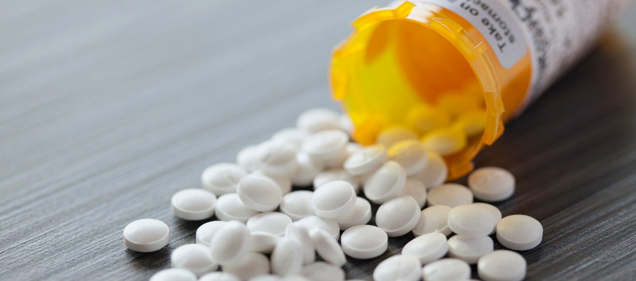 10 Apr 2012 --- White pills spilled on table. --- Image by © Hero Images/Corbis