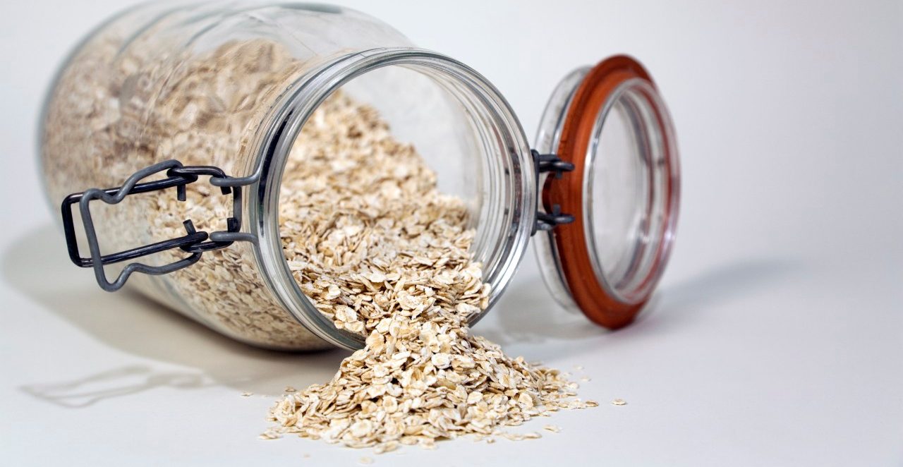 USA --- Rolled oats spilling from a glass jar --- Image by © 145/Snap Decision/Ocean/Corbis