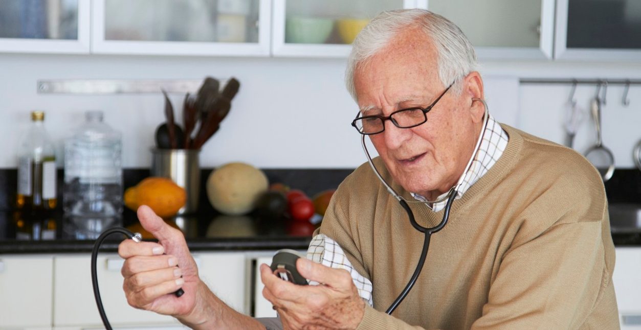 16 Dec 2011 --- Caucasian man taking his own blood pressure --- Image by © Rolf Bruderer/Blend Images/Corbis