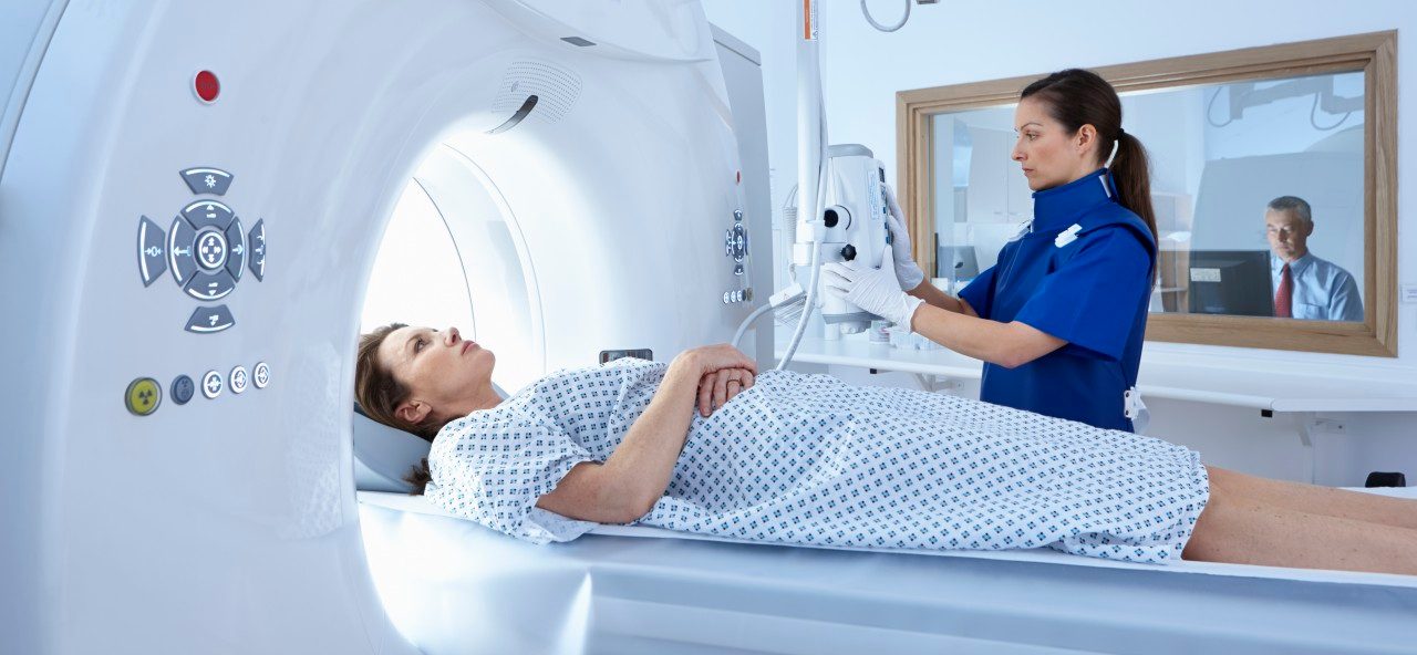 02 May 2014 --- Woman going into CT scanner --- Image by © Phil Boorman/Cultura/Corbis