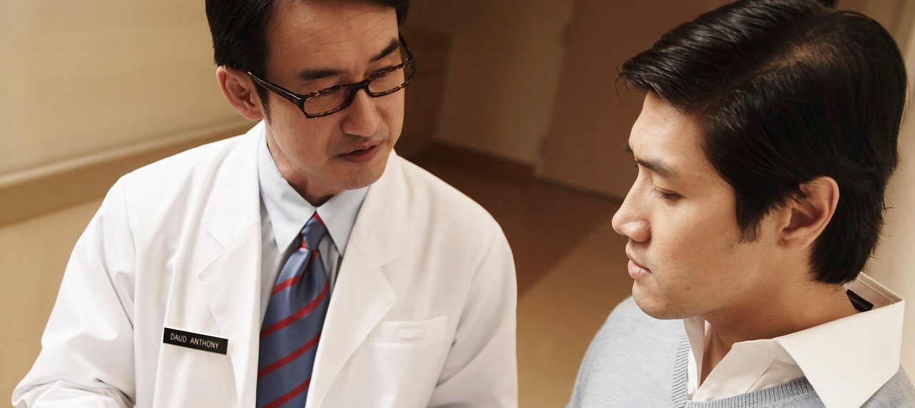 Doctor Talking with Patient --- Image by © Milk Photographie/Corbis