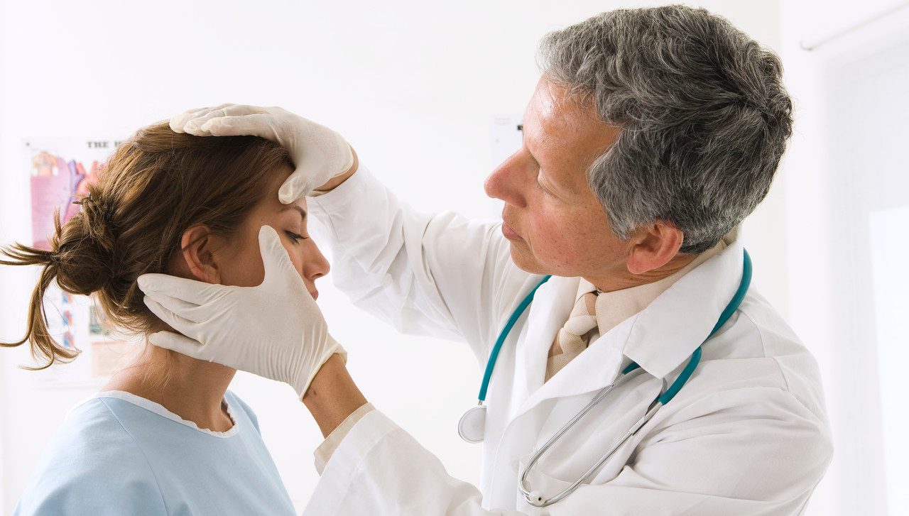 Doctor Examining Woman --- Image by © RCWW, Inc./Corbis