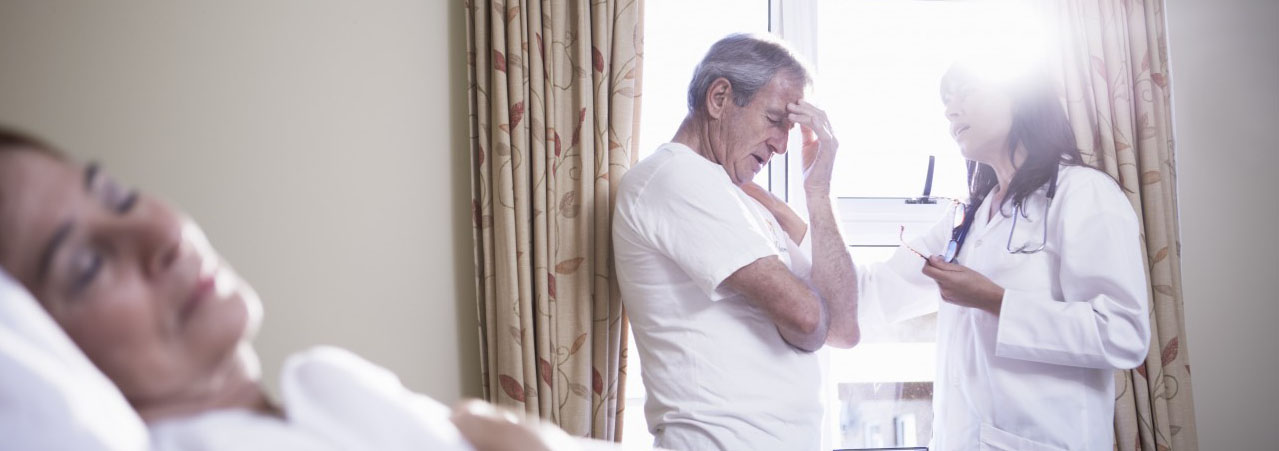 11 Sep 2014 --- Doctor consoling senior man in hospital --- Image by Â© zerocreatives/Westend61/Corbis