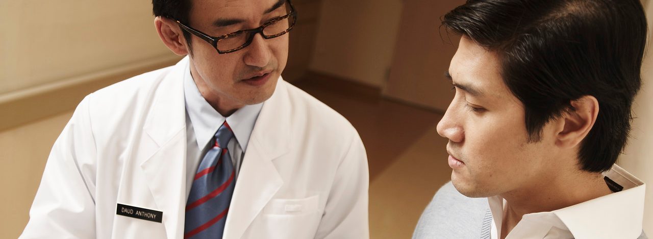 Doctor Talking with Patient --- Image by © Milk Photographie/Corbis