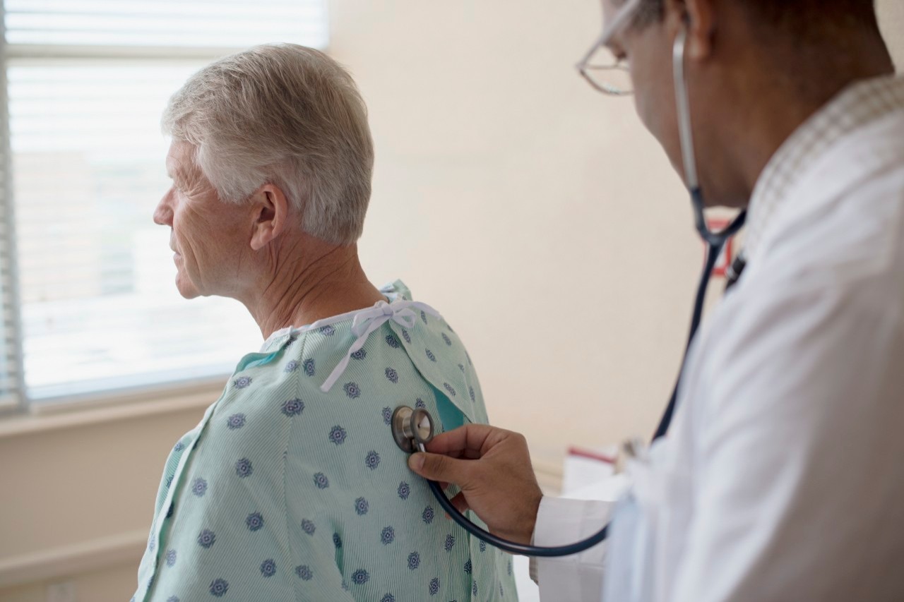 Doctor doing medical examination on patient --- Image by © Hiya Images/Corbis