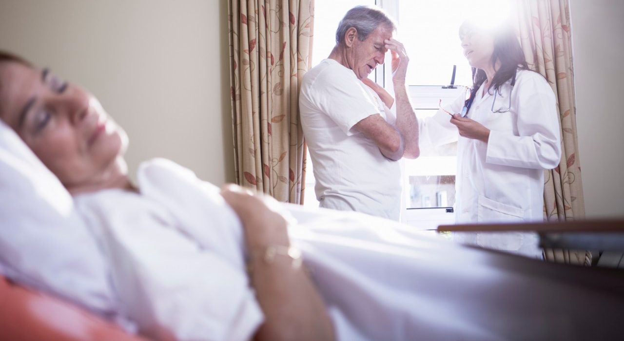 11 Sep 2014 --- Doctor consoling senior man in hospital --- Image by © zerocreatives/Westend61/Corbis