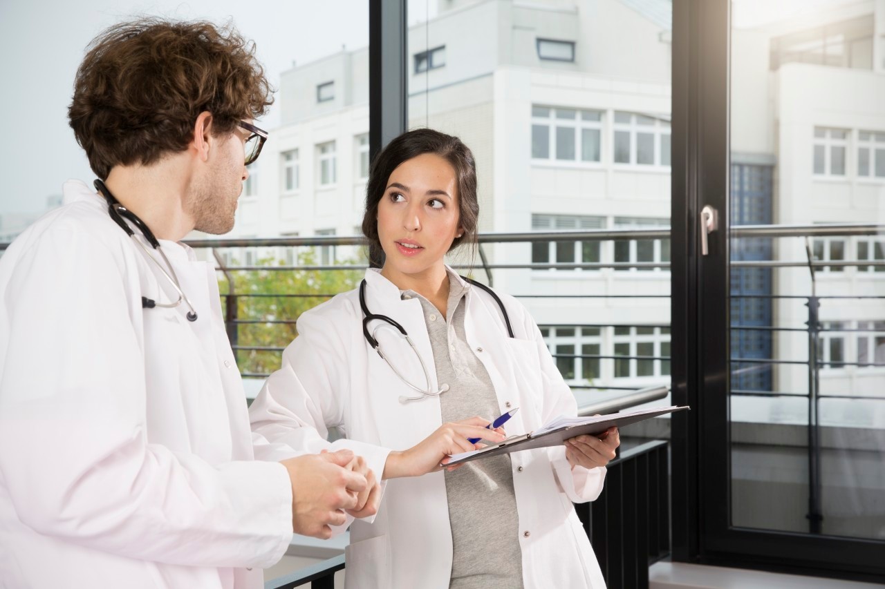 31 Oct 2014 --- Doctors checking documents --- Image by © Florian Kuttler/Westend61/Corbis