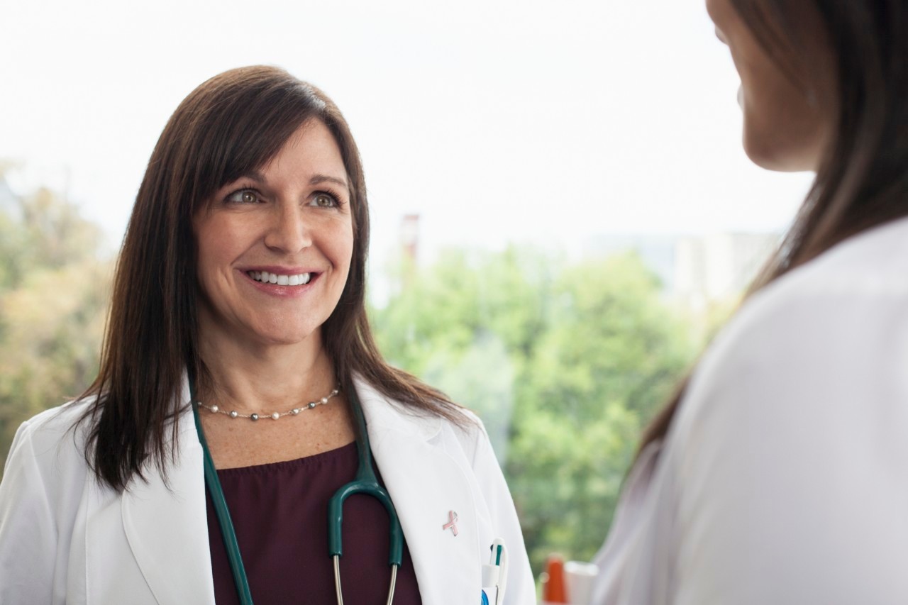 Smiling female doctor --- Image by © Samantha Mitchell/Corbis