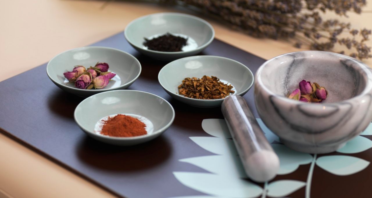 Mortar and Pestle with Dried Herbs --- Image by © Radius Images/Corbis