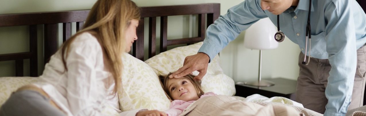 30 Aug 2013 --- USA, New York State, New York City, Doctor on house call examining girl (4-5) --- Image by © Cavan Images/Cavan Images/Corbis