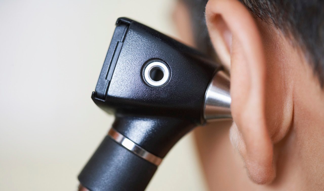 Ear Examination --- Image by © Jack Hollingsworth/Corbis