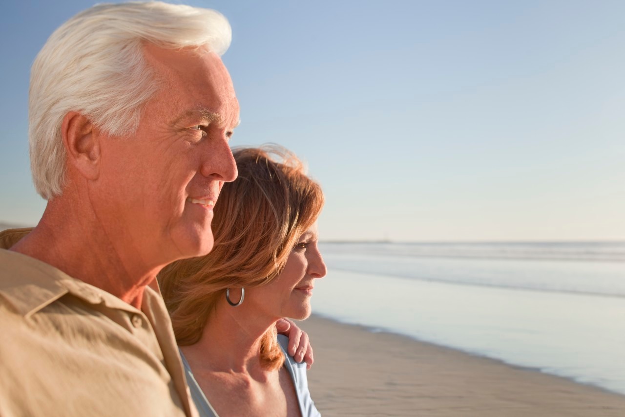 Middle aged couple on beach --- Image by © Patrick Lane/Corbis