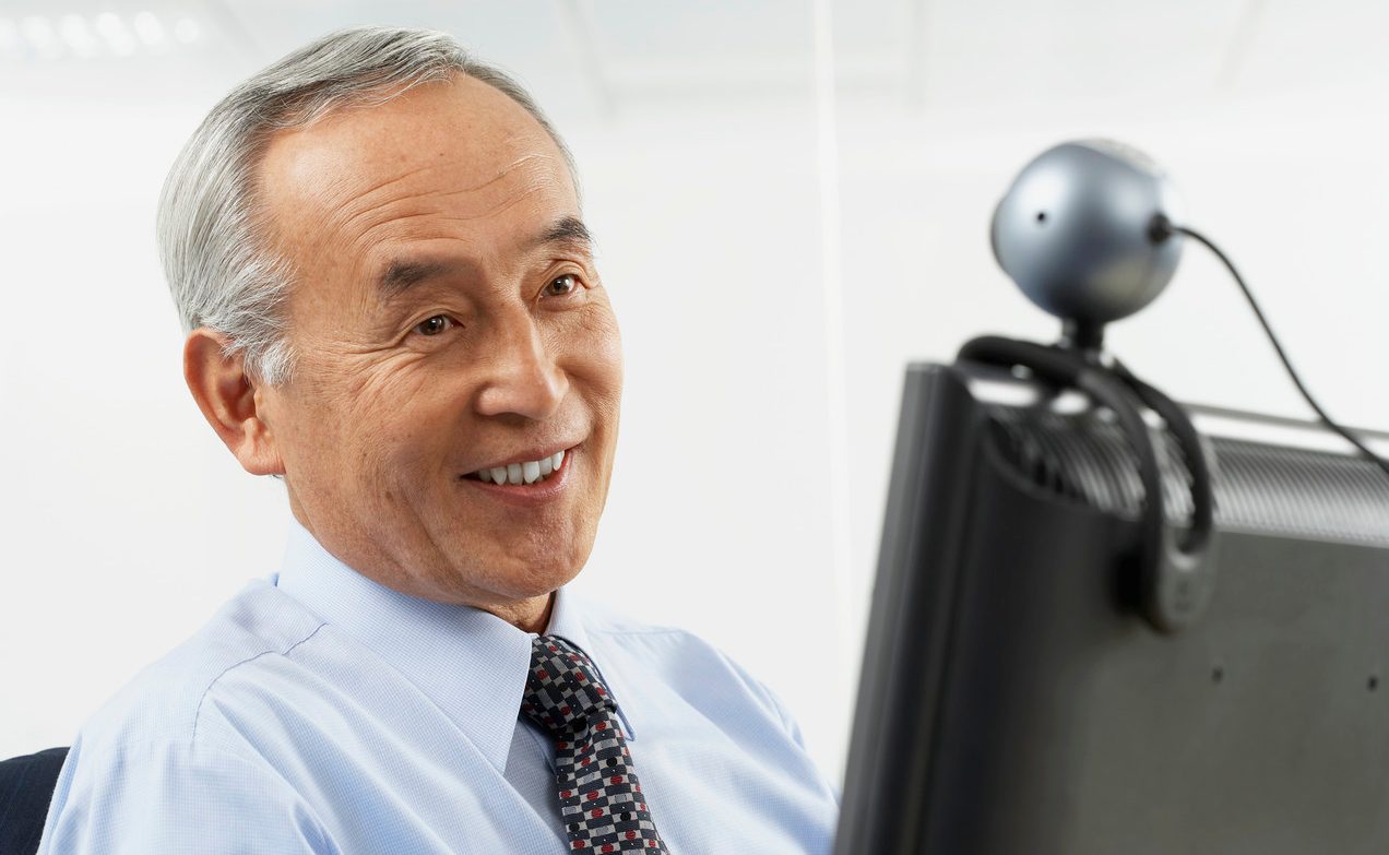 Businessman Using Webcam --- Image by © Corbis