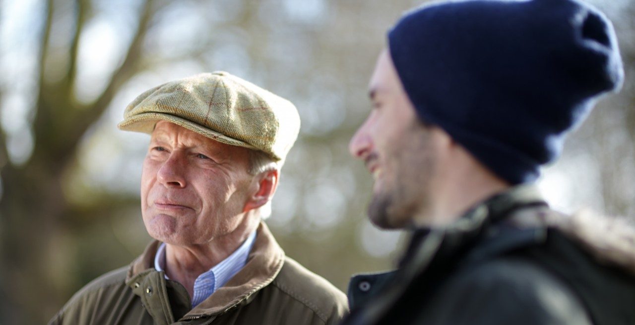 Senior father with son talking together outside --- Image by © MKeal/Corbis