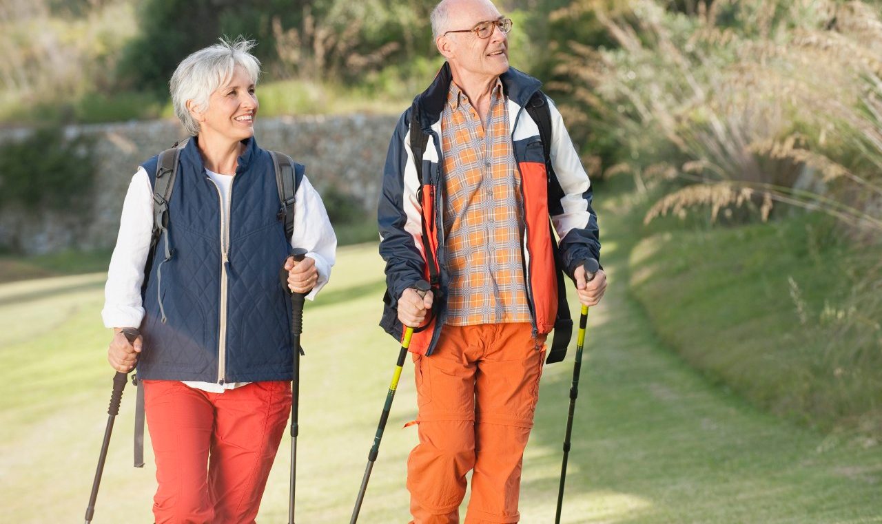 Spain Mallorca Senior couple Nordic Walking --- Image by © Westend61/Corbis