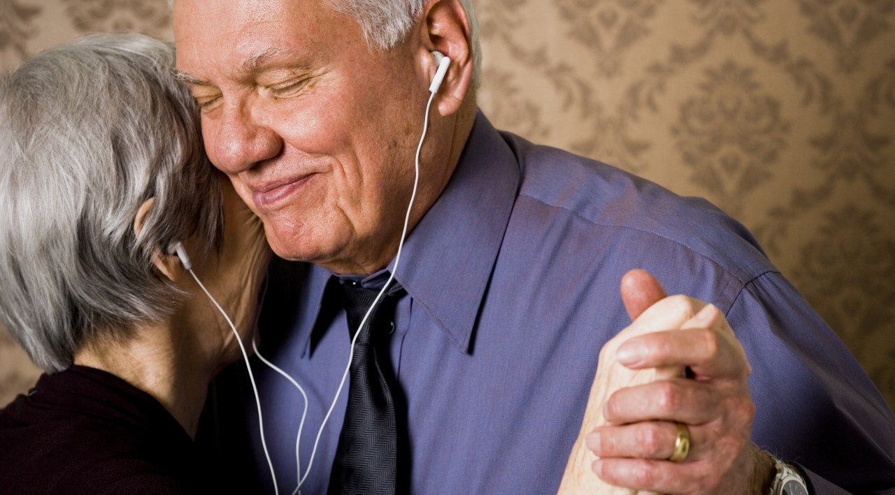 31 Mar 2006 --- Profile of an elderly couple dancing and listening to music --- Image by © Rubberball/Corbis