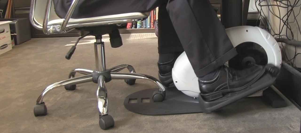 Man using a bicycle desk at work