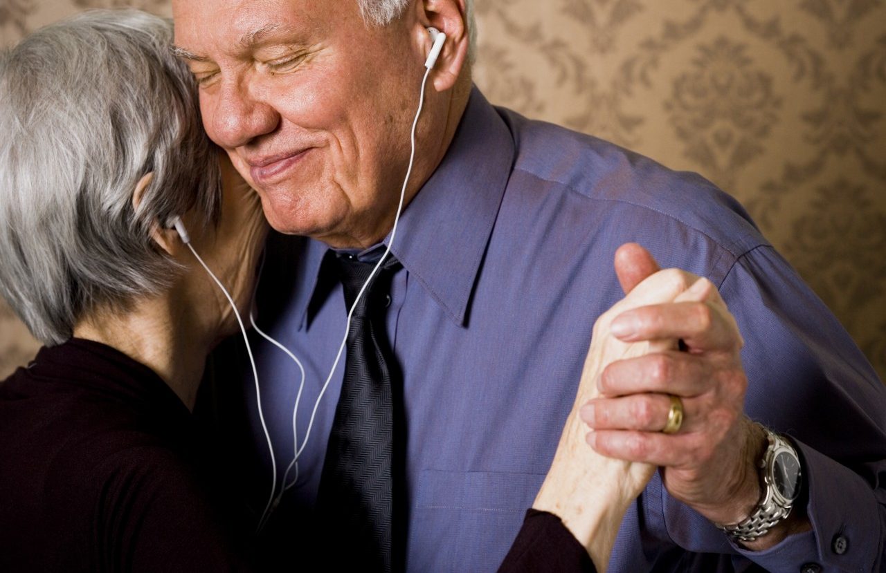 31 Mar 2006 --- Profile of an elderly couple dancing and listening to music --- Image by © Rubberball/Corbis