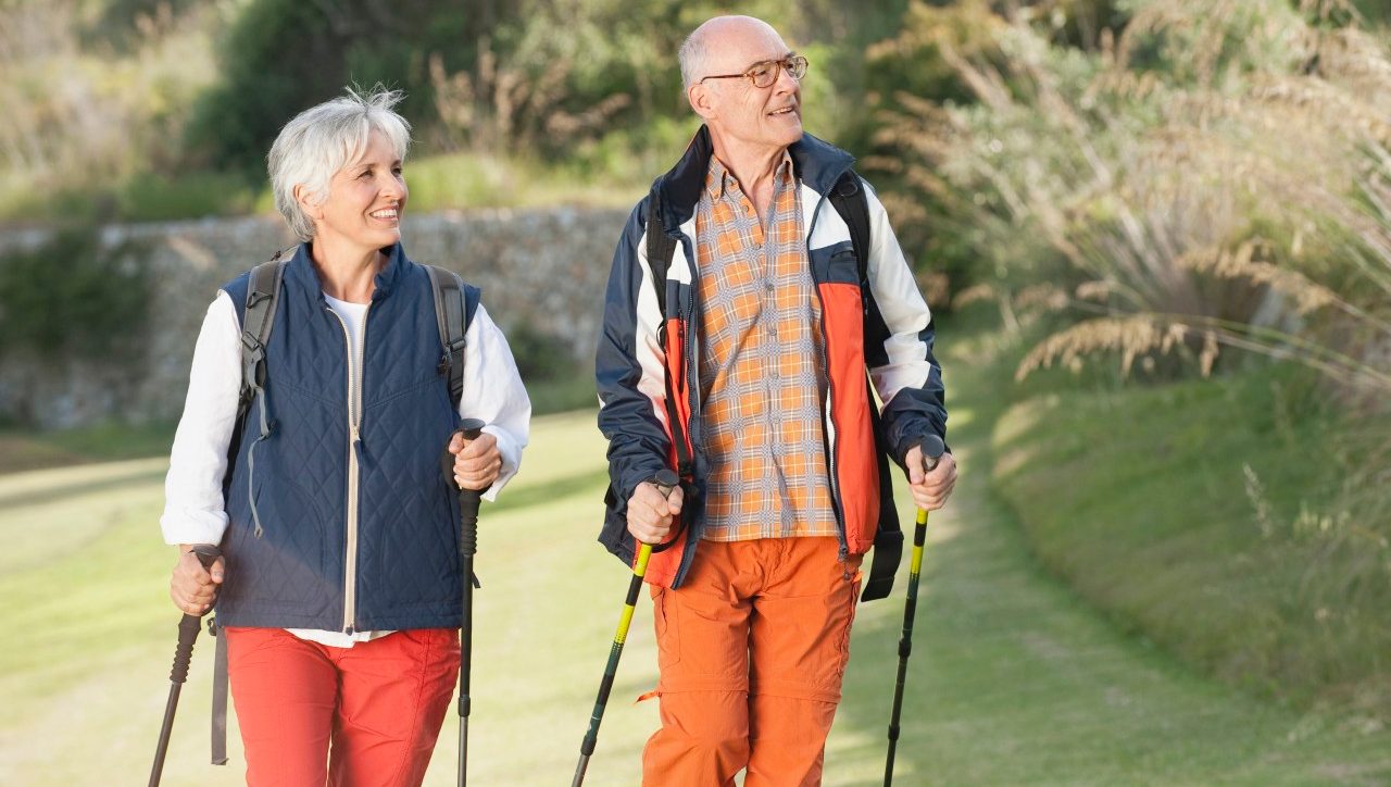 Spain Mallorca Senior couple Nordic Walking --- Image by © Westend61/Corbis